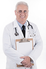 Image showing Senior doctor holding clipboard