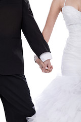 Image showing Bride and groom hands holded together