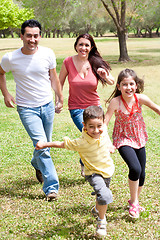 Image showing Family playing in the green field