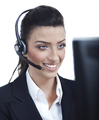 Image showing Young blond business woman with headset closeup