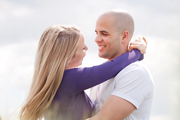 Image showing Loving couple standing under the blue sky