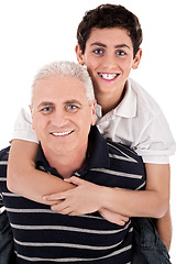 Image showing Grandfather piggybacking his grandson