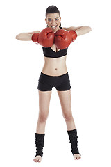 Image showing Female boxer looking very focused with red gloves