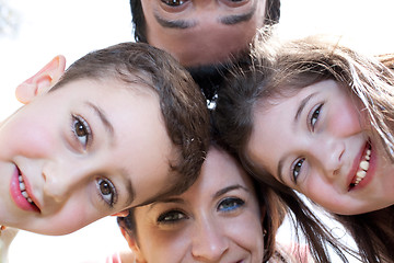 Image showing Closeup portrait of a happy family in circle