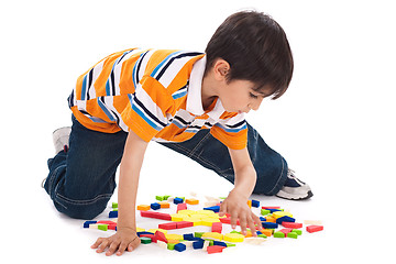 Image showing Cute kid inprocess of joining the blocks