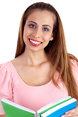 Image showing Beautiful smiling woman looking at you with open book on her hand