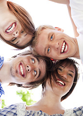 Image showing Circle of happy friends with their heads together