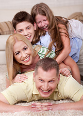 Image showing Portrait of happy family Lying On Top Of Each Other