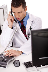 Image showing adult  physician sitting at his desk