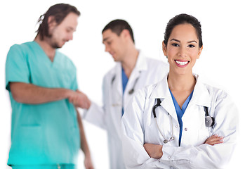 Image showing Attractive young doctor smiling, other doctor giving shake hand to male nurse