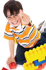 Image showing Boy shows ok sign when playing