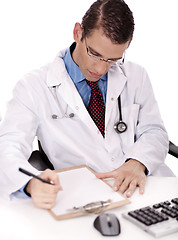 Image showing Young physician write down notes