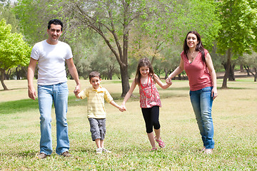 Image showing Family posing to camera in the park