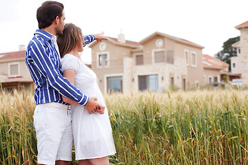 Image showing Young romantic couple standing together