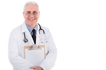 Image showing Senior doctor holding clipboard