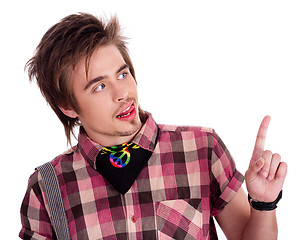 Image showing Trendy boy pointing his finger in the left