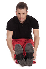 Image showing Fitness men streching leg