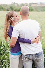 Image showing Young romantic couple standing together
