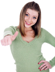 Image showing Smiling beautiful girl showing her thumps up