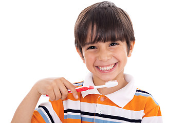 Image showing Closeup of cute kid brushing his teeth