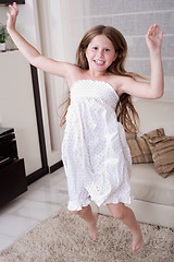 Image showing Young little girl jumping