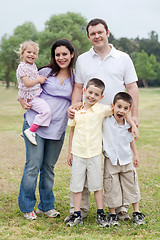 Image showing Happy couple with divine kids looking at you