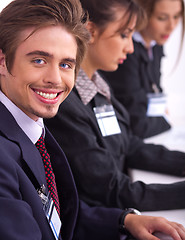 Image showing Closeup of attractive business men with colleague