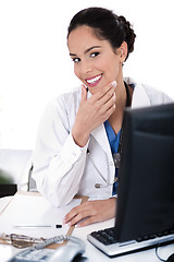 Image showing Female doctor portrait smiling and looking computer