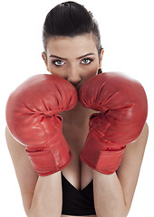 Image showing Woman covering her mouth with red gloves