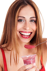 Image showing Close up shot of smiling woman having ice cream