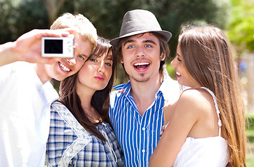 Image showing Group of College students standing together taking a self portrait