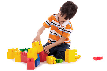 Image showing Smart boy playing with blocks