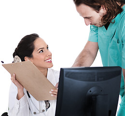 Image showing Doctor explains patient record to the male nurse