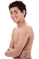 Image showing Boy giving strange expression and smiling