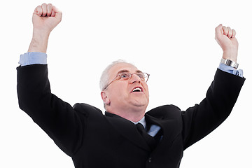 Image showing Champion senior business man standing with fists clenched in victory