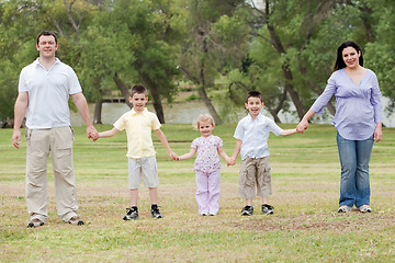 Image showing Happy family holding hands