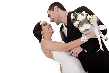 Image showing Bride and groom just married posing happily