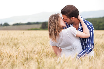 Image showing Happy young Couple hugging and kissing eachother