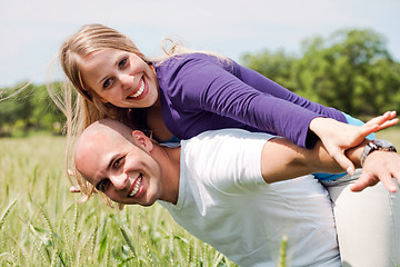 Image showing Happy couple enjoying with their arms outstreched
