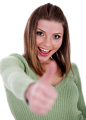 Image showing Smiling beautiful girl showing her thumps up