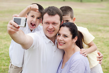 Image showing Happy family pilled together and taking self portrait