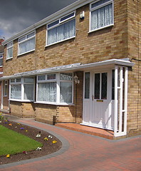 Image showing semi-detached house with block paved front