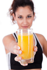 Image showing fitness girl holding a fresh juice