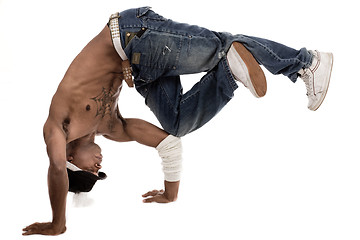Image showing Dancer balancing his knees with his elbows