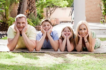 Image showing Lovely family on there backyard and looking at you