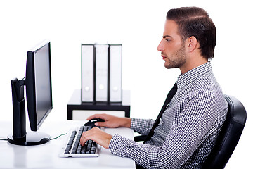 Image showing Business man verfying data on his computer