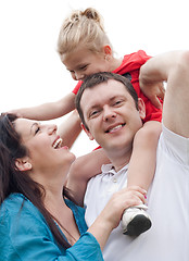 Image showing Portrait of cheerful couple with their daughter having fun