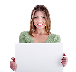 Image showing Charming young girl holding white bill board