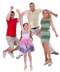 Image showing Cheerful family jumping to the air and having fun