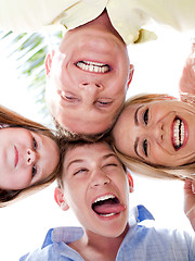 Image showing Happy family joining their heads together and moking fun
